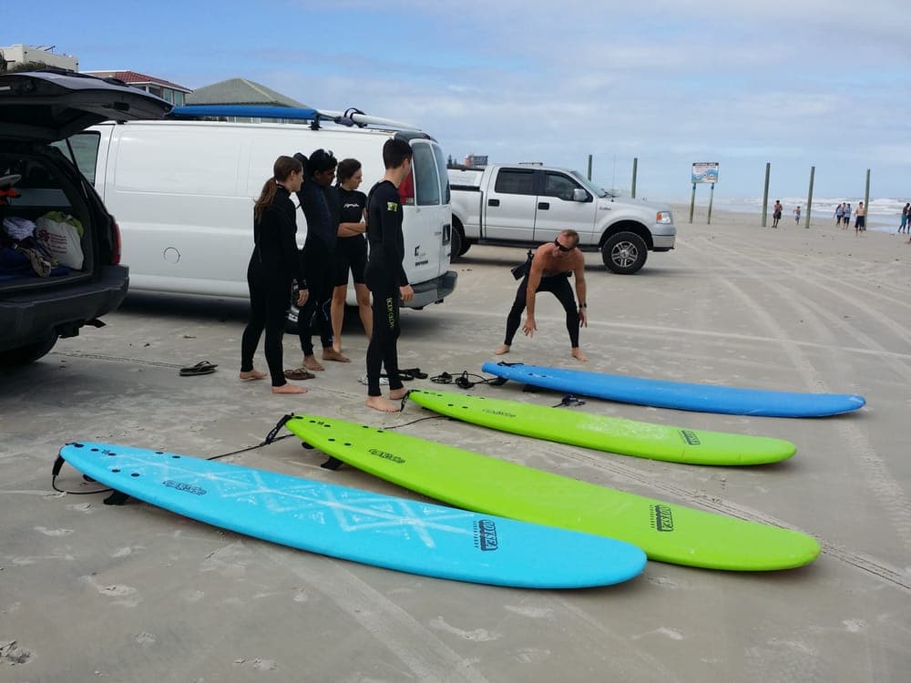 Surf school van and boards on Daytona Beach